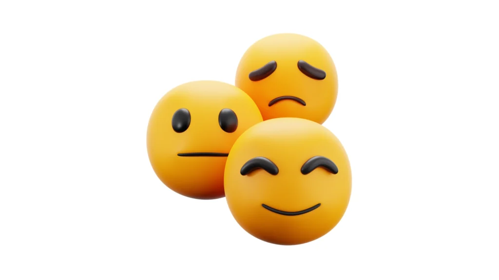 A 3D illustration featuring three emoticons representing different human emotions: denial (neutral face), amazement (smiling face), and fear (sad face). This image symbolizes the diverse emotional reactions people have to the rise of AI and artificial intelligence.